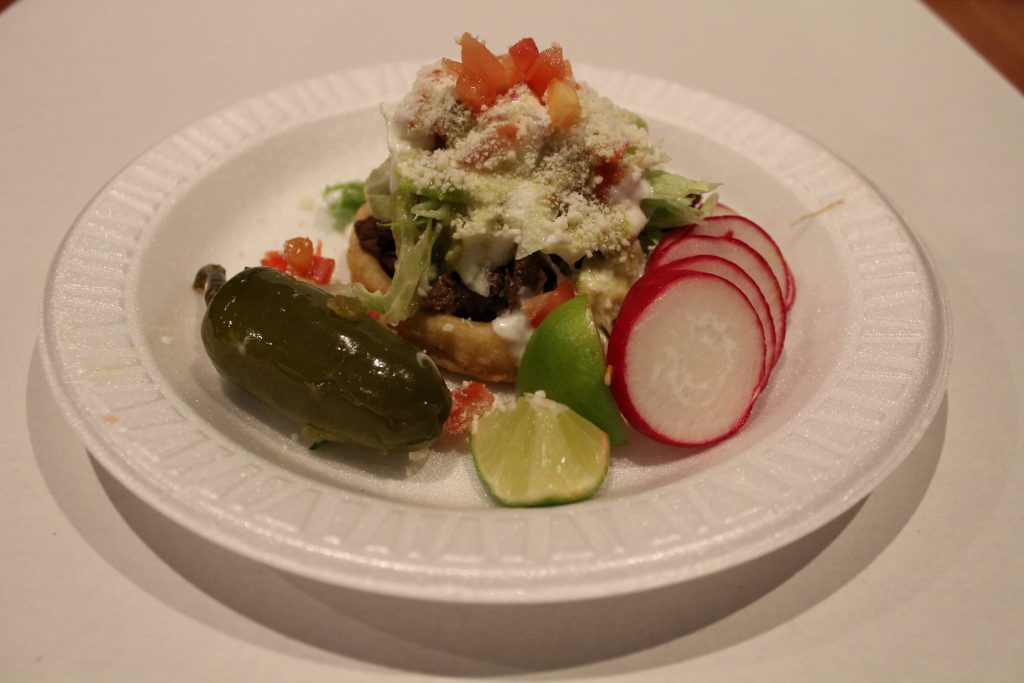 A delicious plate of food with jalepenos and radishes